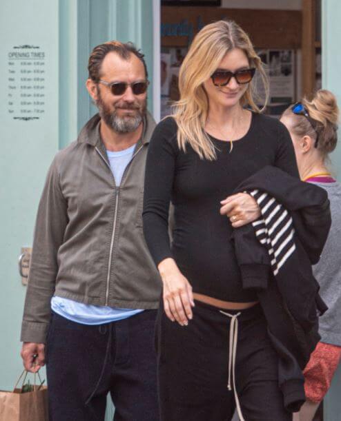 Rafferty Law’s Dad, Jude Law, with his wife.